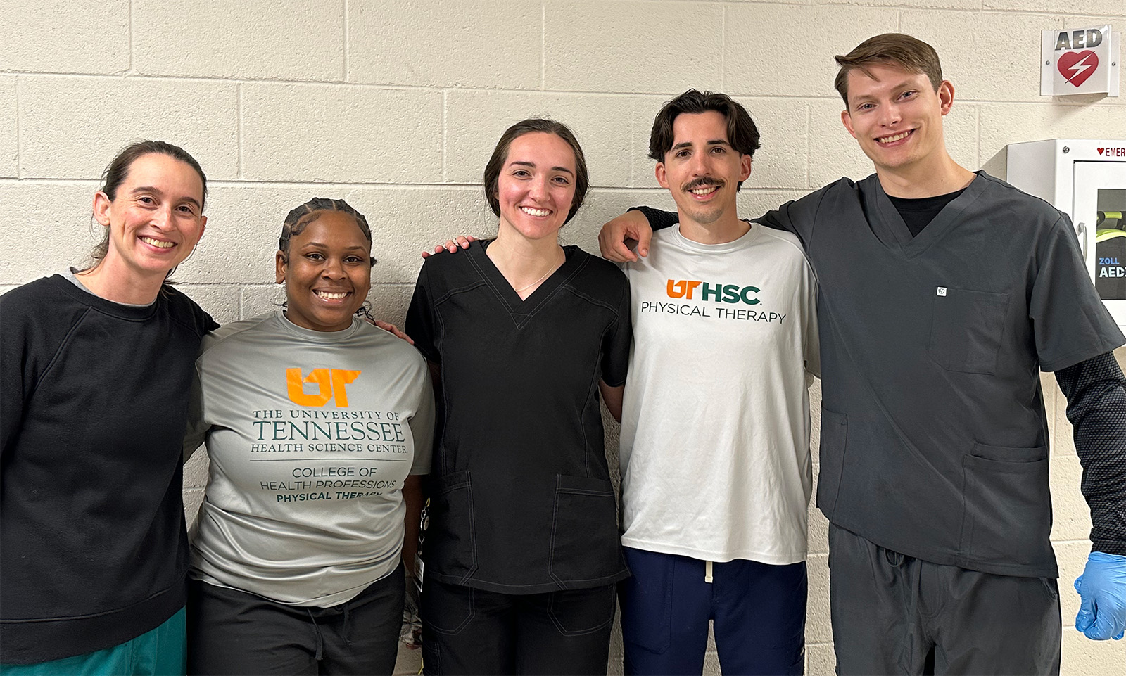 Sarah posing with several friends at UTHSC