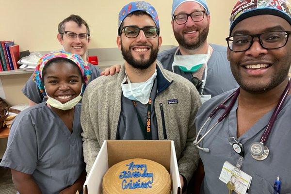 Residents posing with the birthday cake