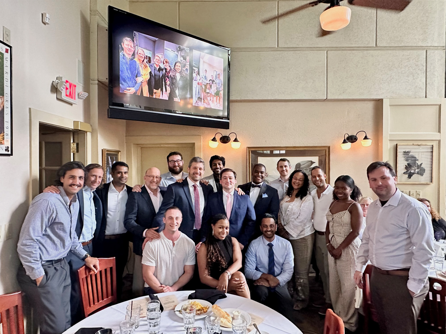 Residents gathered around a table at graduation