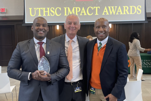 Dr. Molyneaux, the chancellor, and Michael Alston at the 2024 Impact Awards 