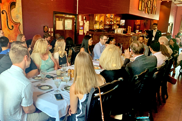 Residents sitting at a table in a restaurant during graduation