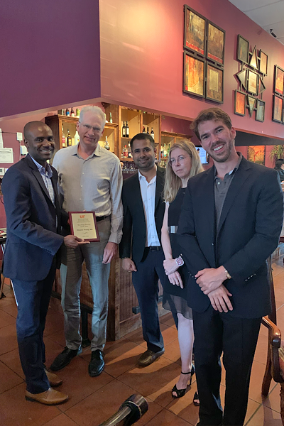 Residents with faculty during graduation