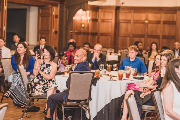 Graduation attendees sitting at a table