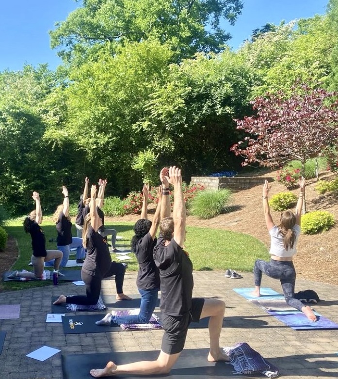 Group doing yoga outside