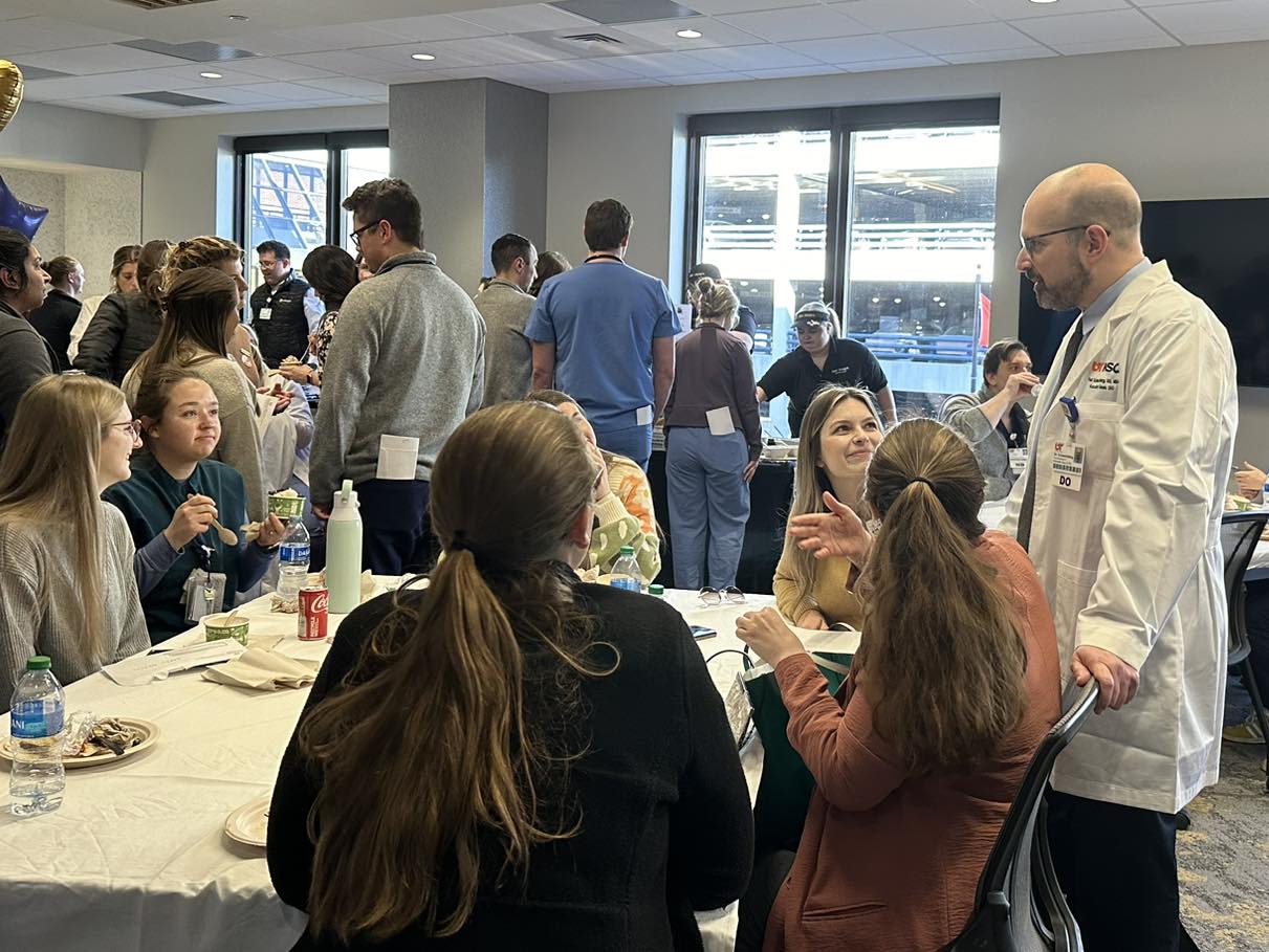 Our DIO, Dr. Paul Schwartzberg personally thanking a group of residents at one of the tables at lunch