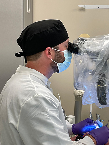 Dr. Mauney working on a patient in the endodontics clinic.