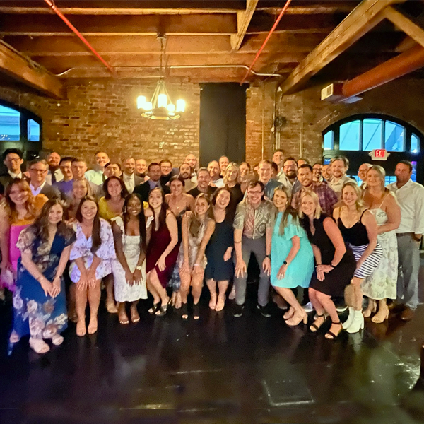 smiling residents group photo in an indoor setting