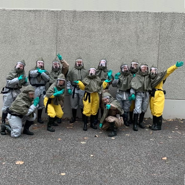 Residents in safety gear outside