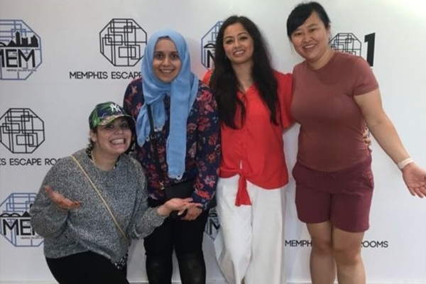 Four female fellows at an escape room