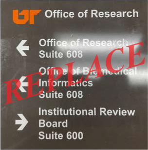 Old directional signage that is old and needs to be replaced with the current standard