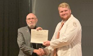 Student receiving a certificate