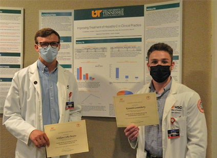 Residents before a research poster