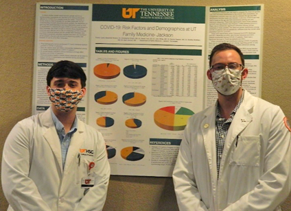 Residents before a research poster