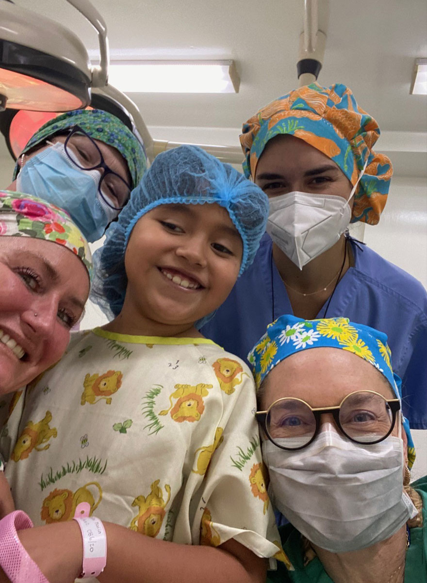 Doctor's with child patient before going into surgery.