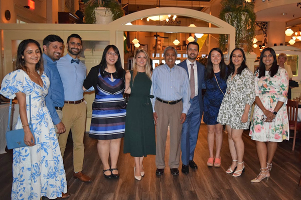 Group photo of fellows, faculty, and family at graduation