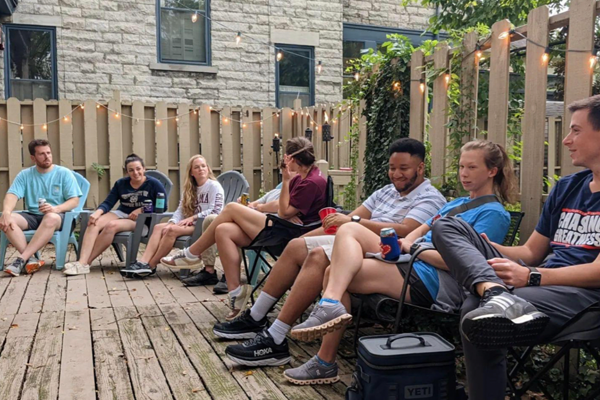 residents sitting outside of a deck