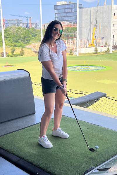 Female resident on the driving range