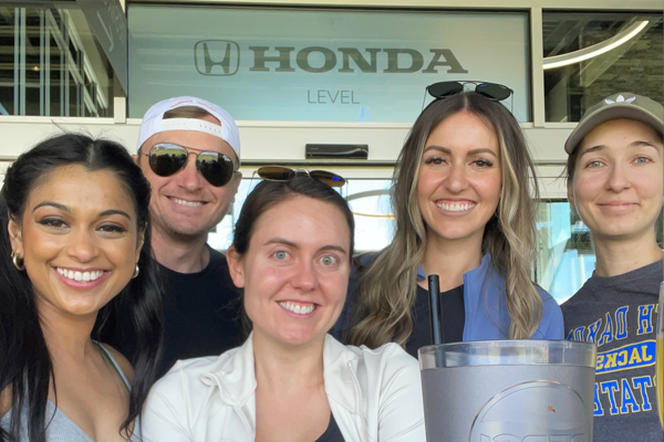 5 residents in front of a Honda sign