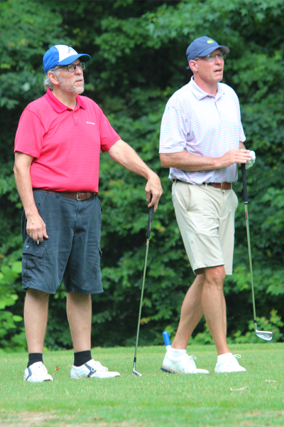 Faculty members on a golf course