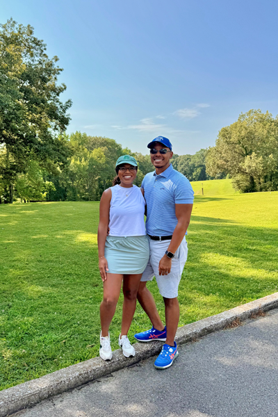 Residents smiling for the photo on a golf course