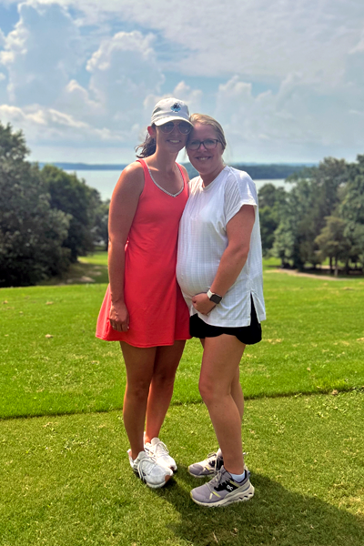 Two female residents by the lake at a golf course