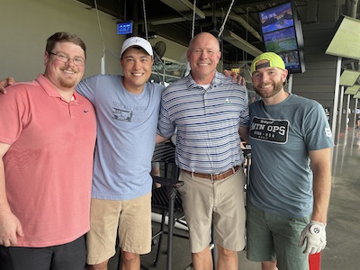 Residents and Dr. Mitchell at a golf range