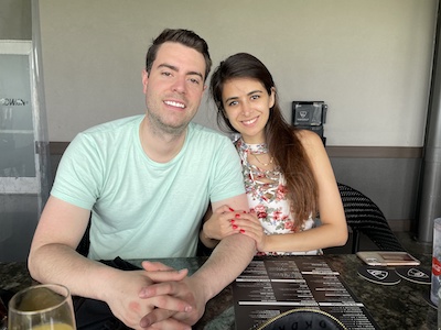 Resident couple sitting at a dinner table at the golf range