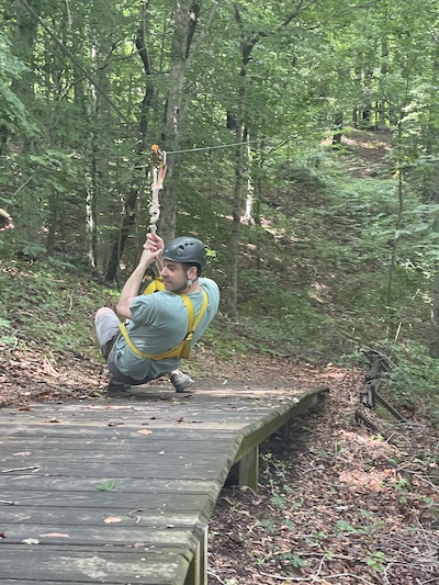 Residents swinging from tree outdoors