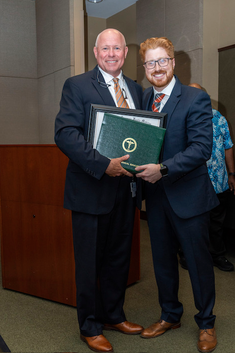 Dr. Mitchell with graduate