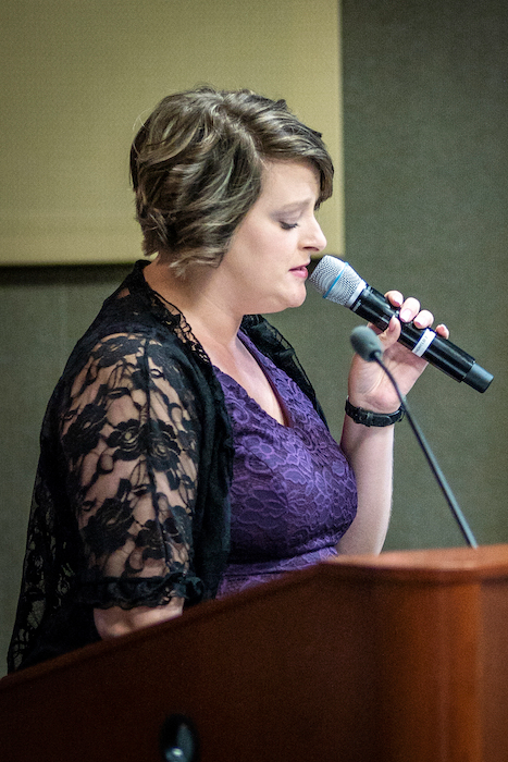 Female speaking at the podium