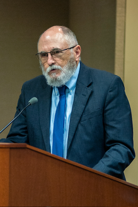 Male speaking at the podium