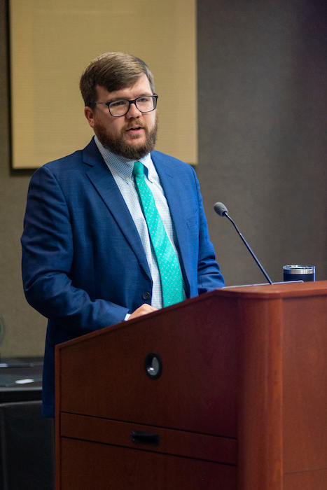 Male speaking at the podium