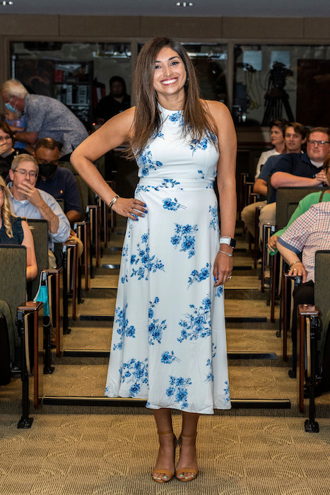 Resident walking the aisle at graduation