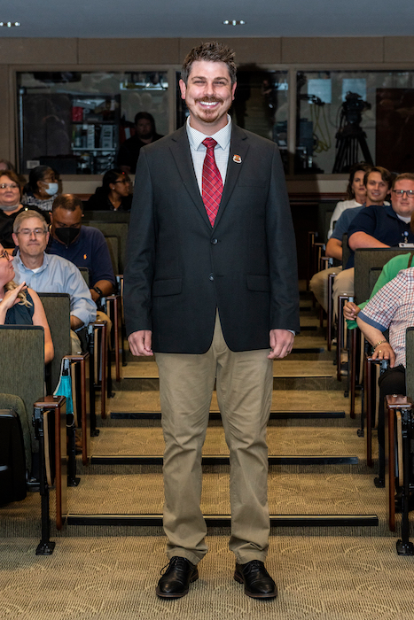 Resident walking the aisle at graduation