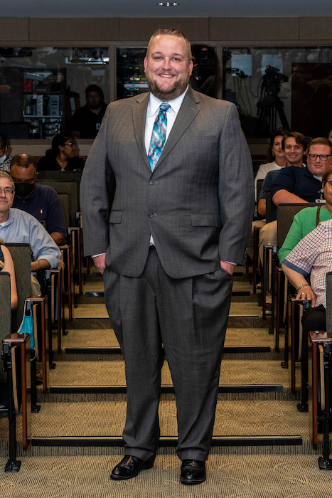 Resident walking the aisle at graduation