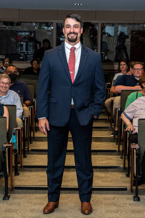 Resident walking the aisle at graduation