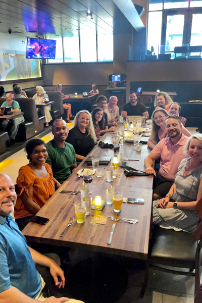 Residents and faculty at a dinner table