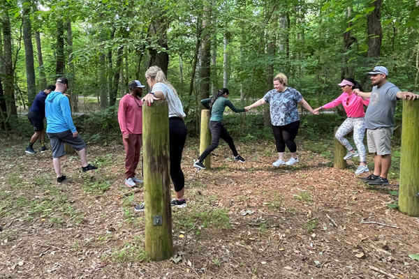 residents outside on a ropes course