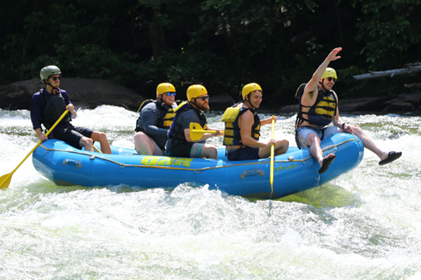 Residents on a raft in the rapids