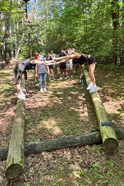 Residents holding hands during a team building exercise