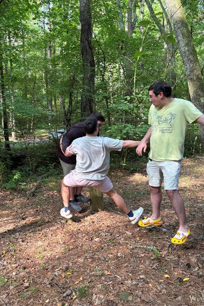 Residents holding hands during a team building exercise