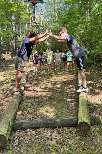 Residents holding hands during a team building exercise