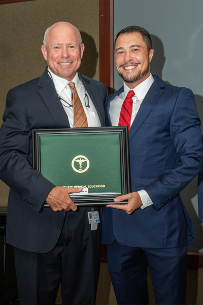 Program Director and resident with certificate