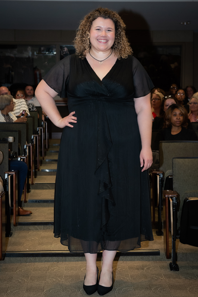 Female resident walking the aisle at graduation