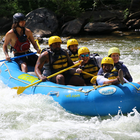 Residents on a raft in the rapids