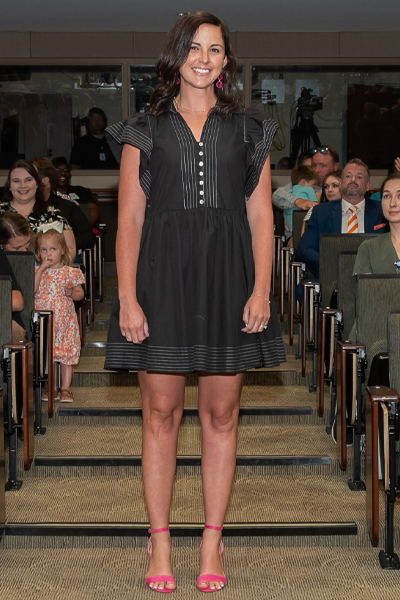 Female walking the aisle at graduation