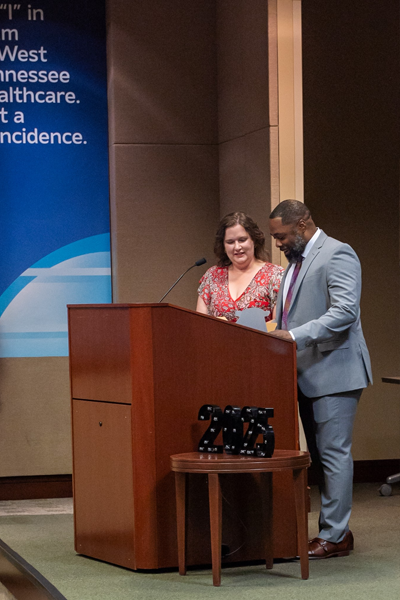 Faculty at podium during graduation