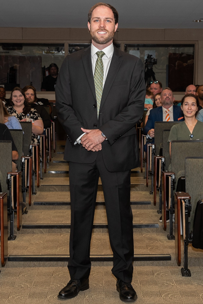 Male walking the aisle at graduation