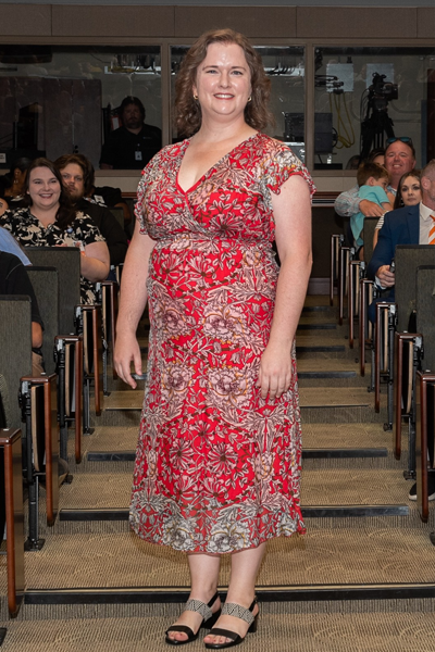 Female walking the aisle at graduation