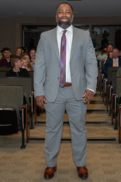 Male walking the aisle at graduation